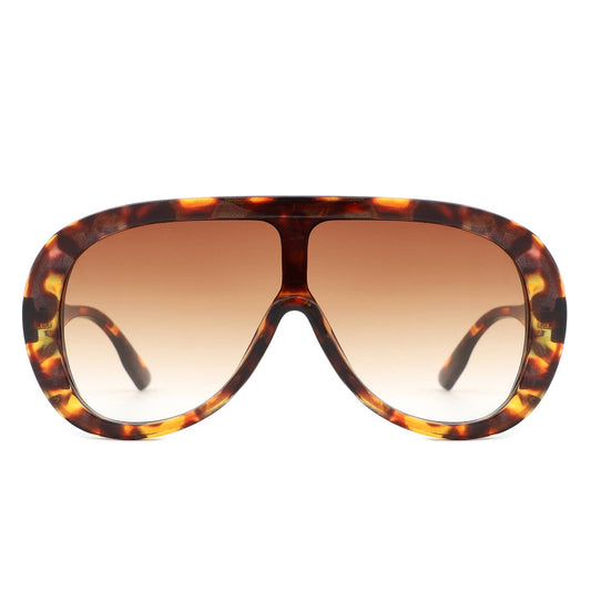 Tortoiseshell sunglasses with brown gradient lenses on a white background