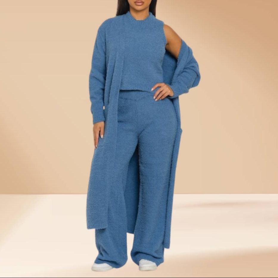 Person wearing a blue outfit on a beige background