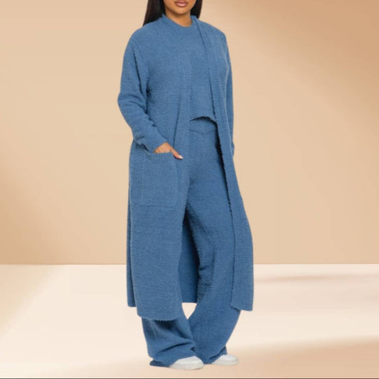 Blue long cardigan and pants set on a beige background