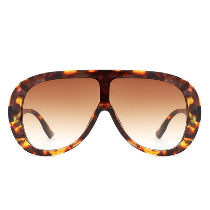Tortoiseshell sunglasses with brown gradient lenses on a white background
